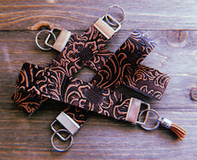 Load image into Gallery viewer, Dark Brown With Light Red/Tan Floral Accent Textured/Stamped Wristlets
